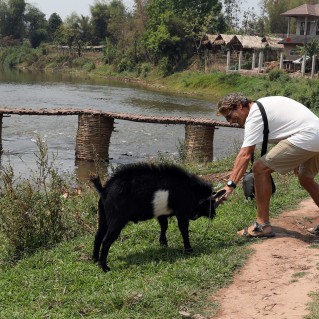 Richard teasing a goat