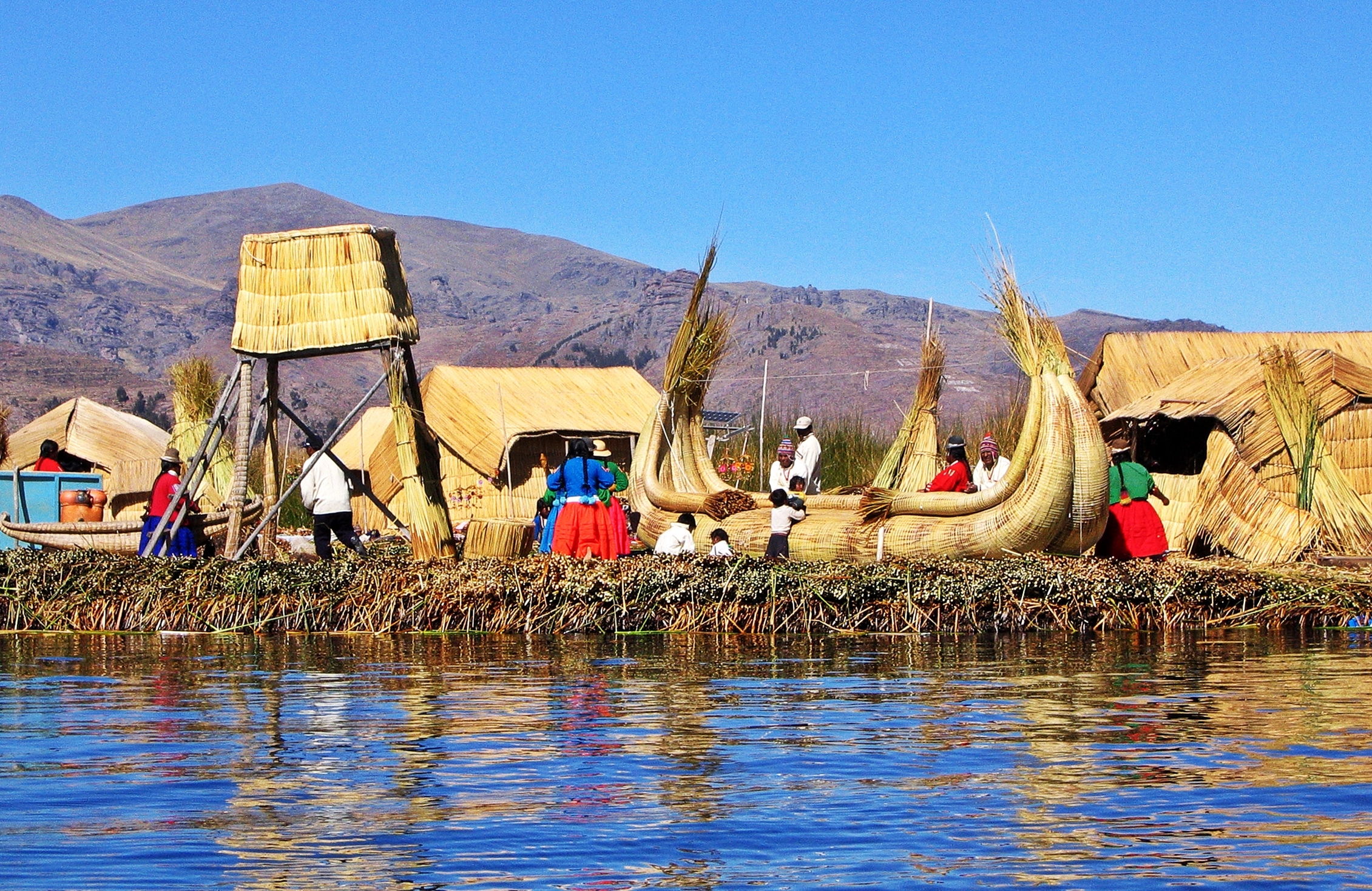 Floating reed village and boats, Lake Titicaca