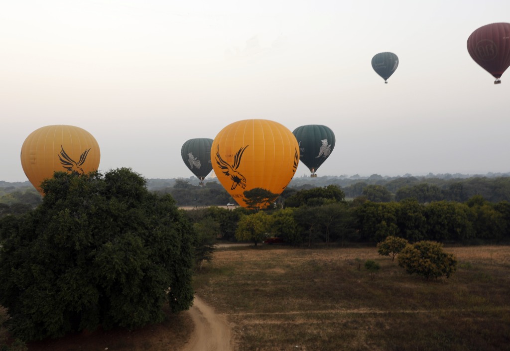 Hot air balloons over ancient temples in Bagan